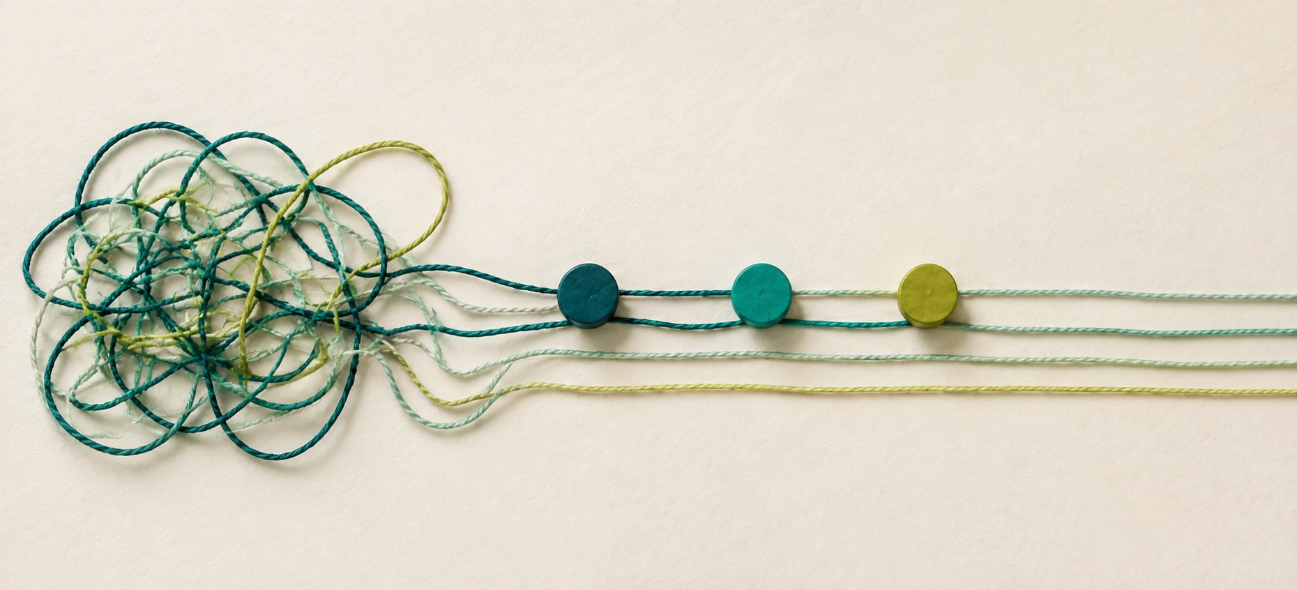Tangled threads becoming four clear paths through a series of decision points